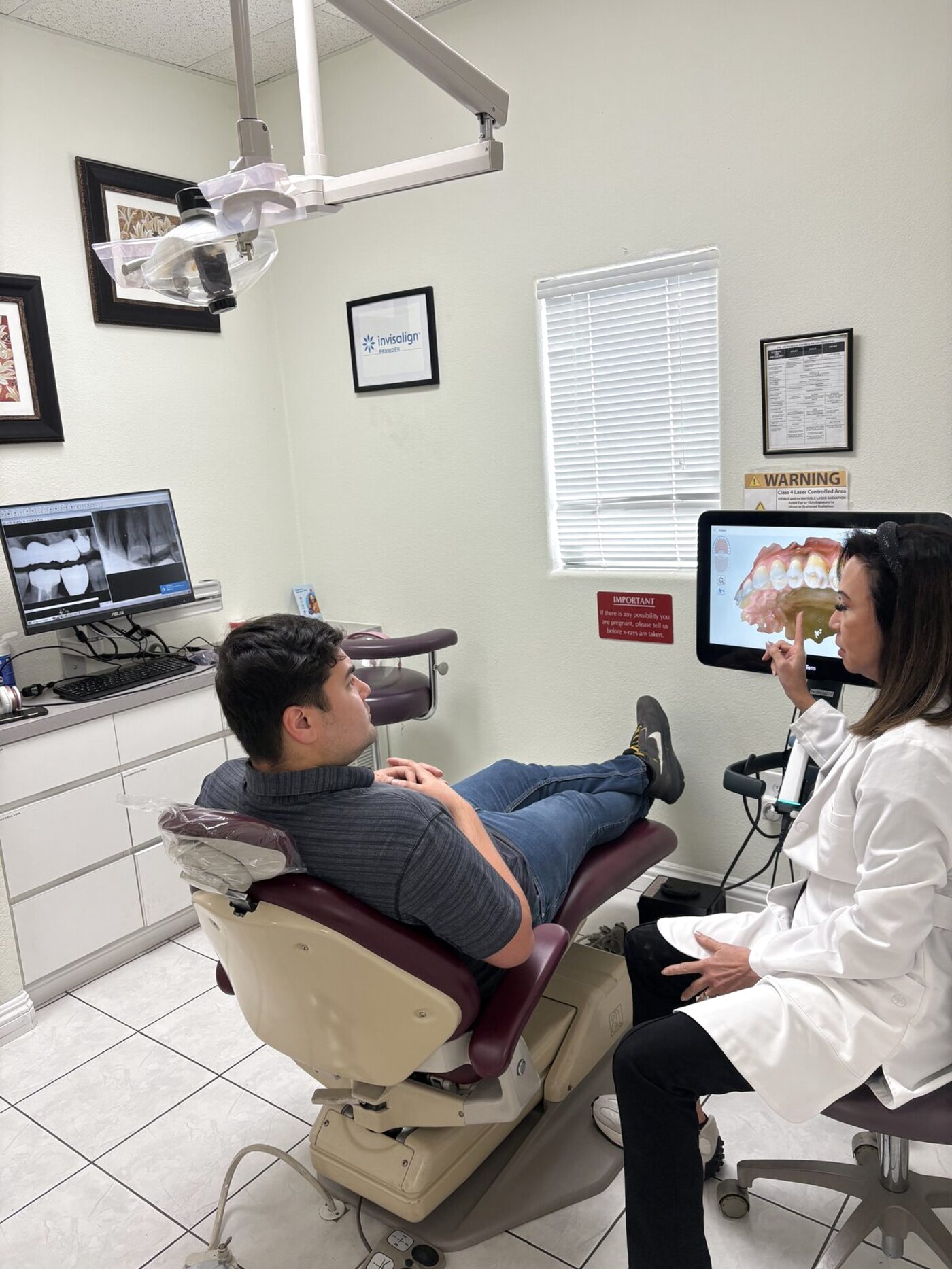 Dr. Mallari reviewing an iTero digital scan with a patient